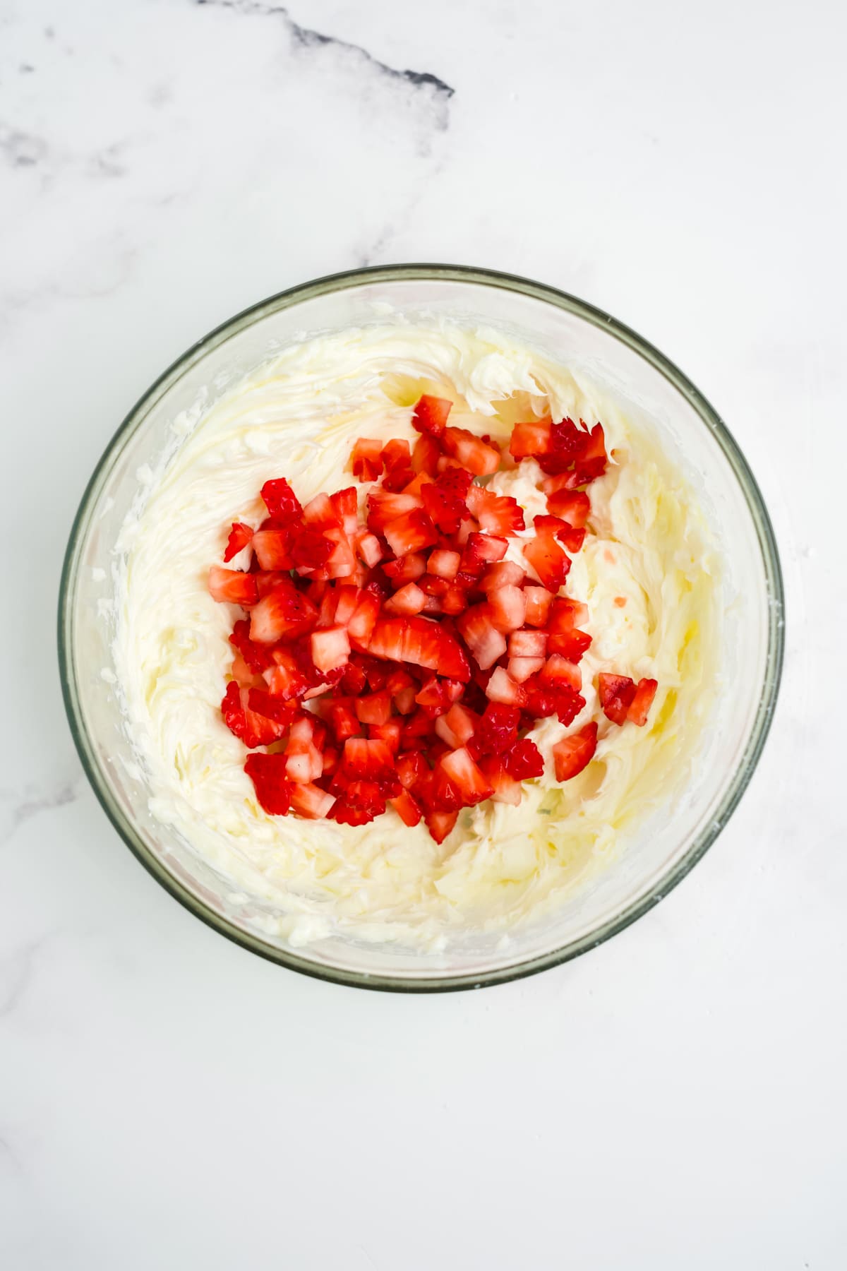 Diced strawberries added into the mixture.