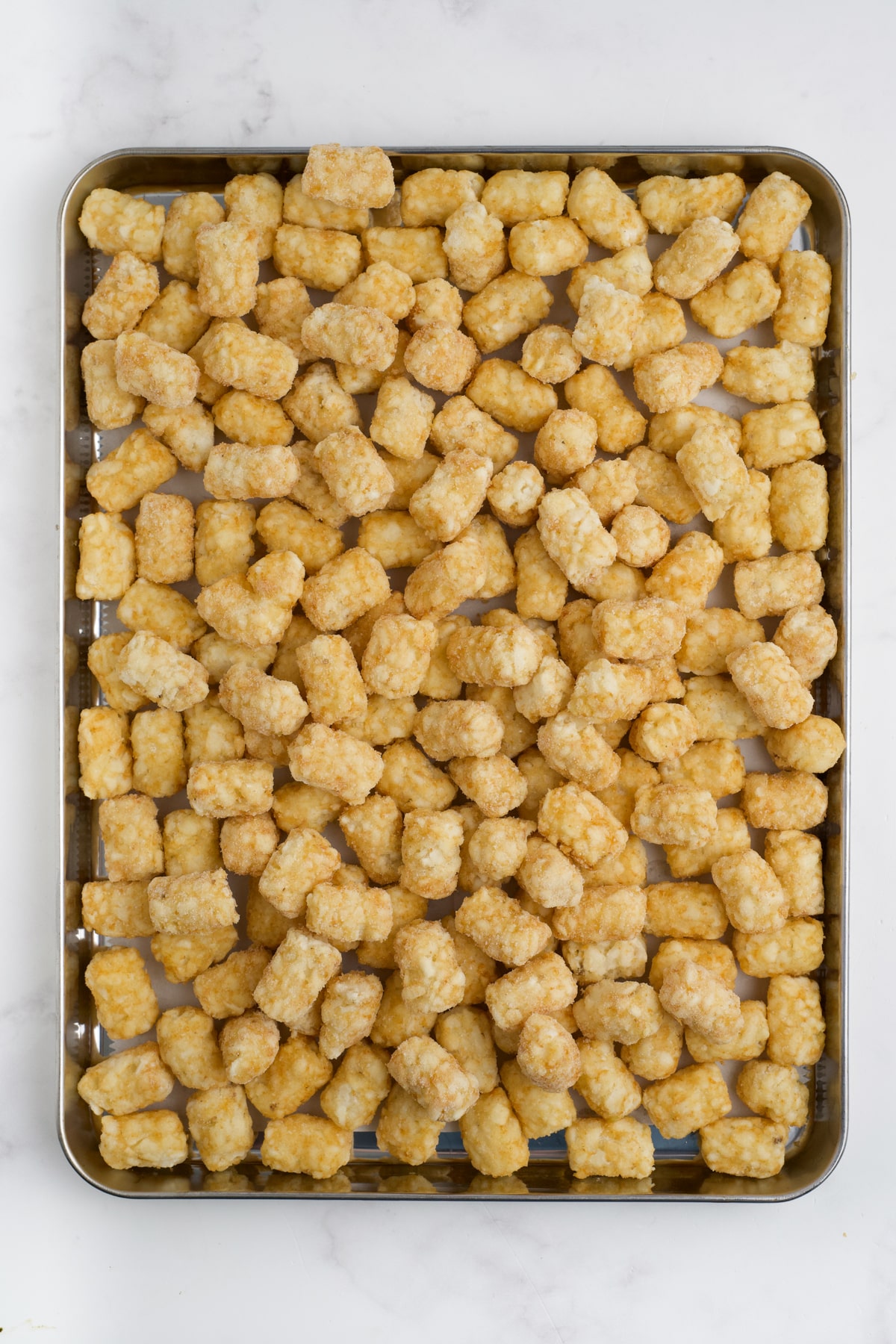 Tater tots on a pan.