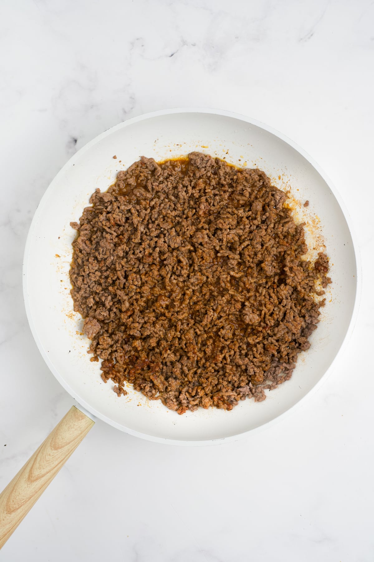 Meat browned in a skillet.
