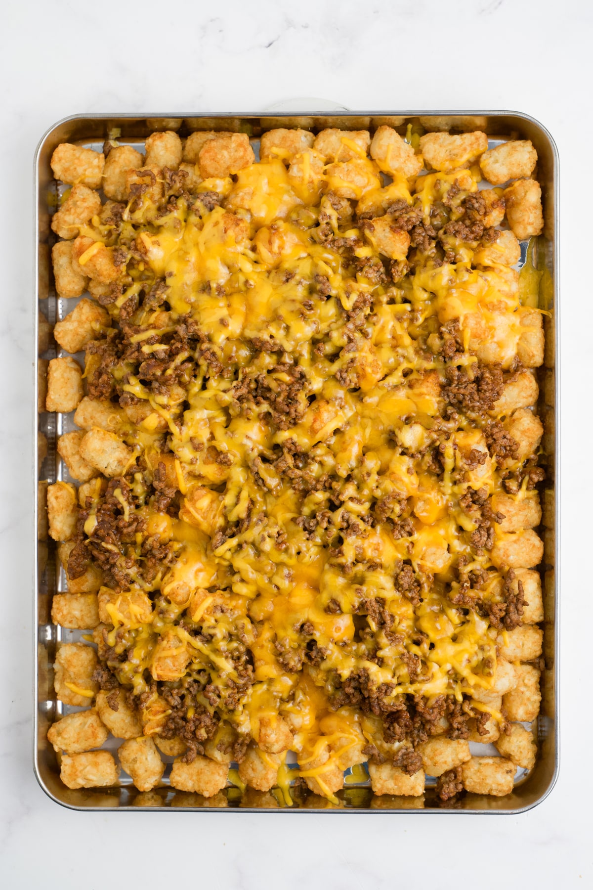Baked totchos on a pan.