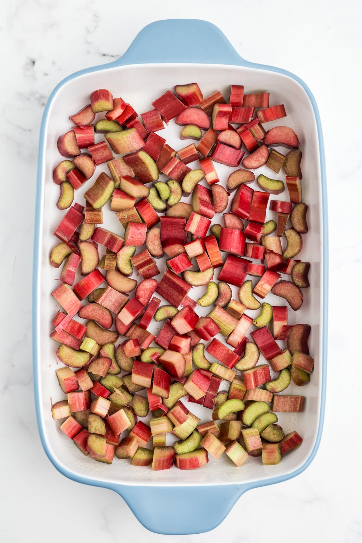 Rhubarb chopped and added to the bottom of a casserole dish. 