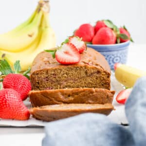Strawberry banana bread with strawberries on top.