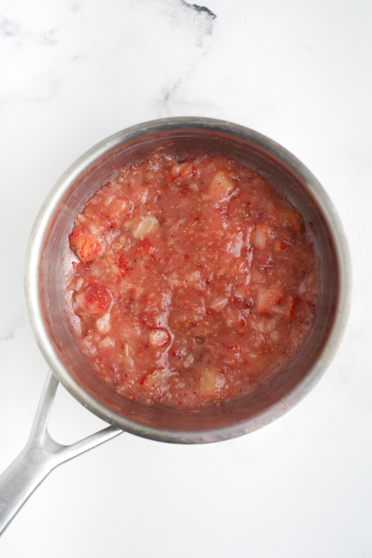 Strawberries, sugar, and cornstarch in a saucepan.