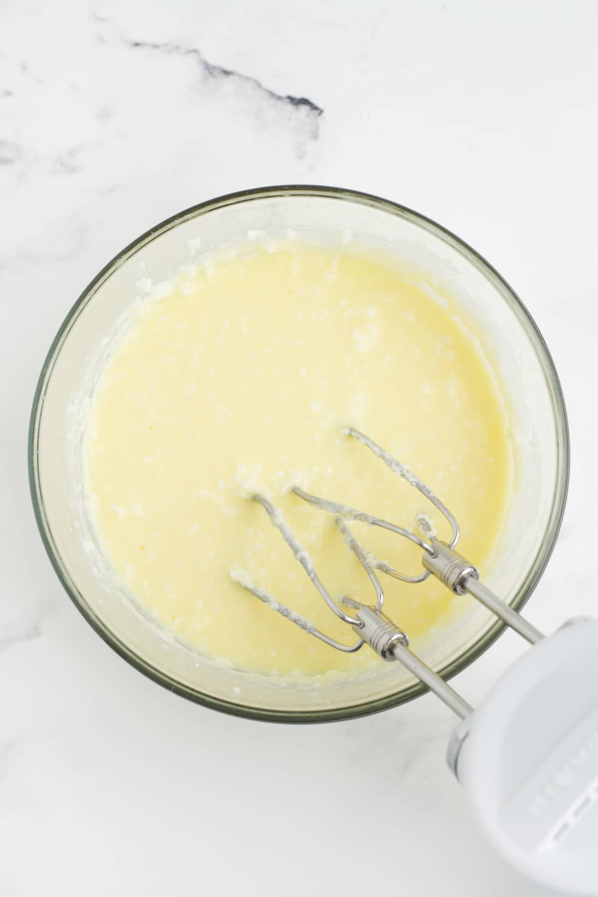Eggs mixed into the butter and sugar mixture. 