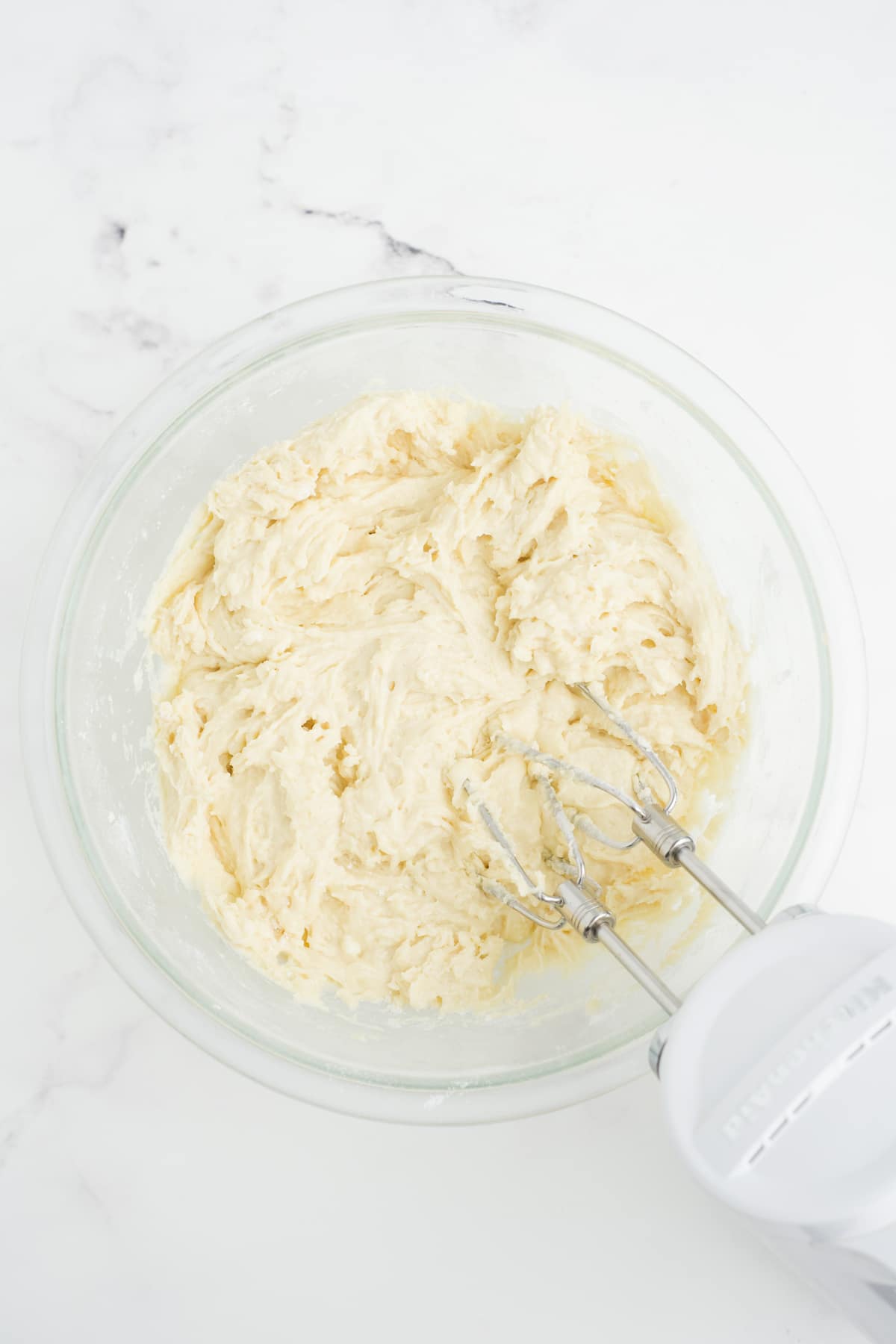 Dry and wet ingredients mixed together with an electric mixer. 