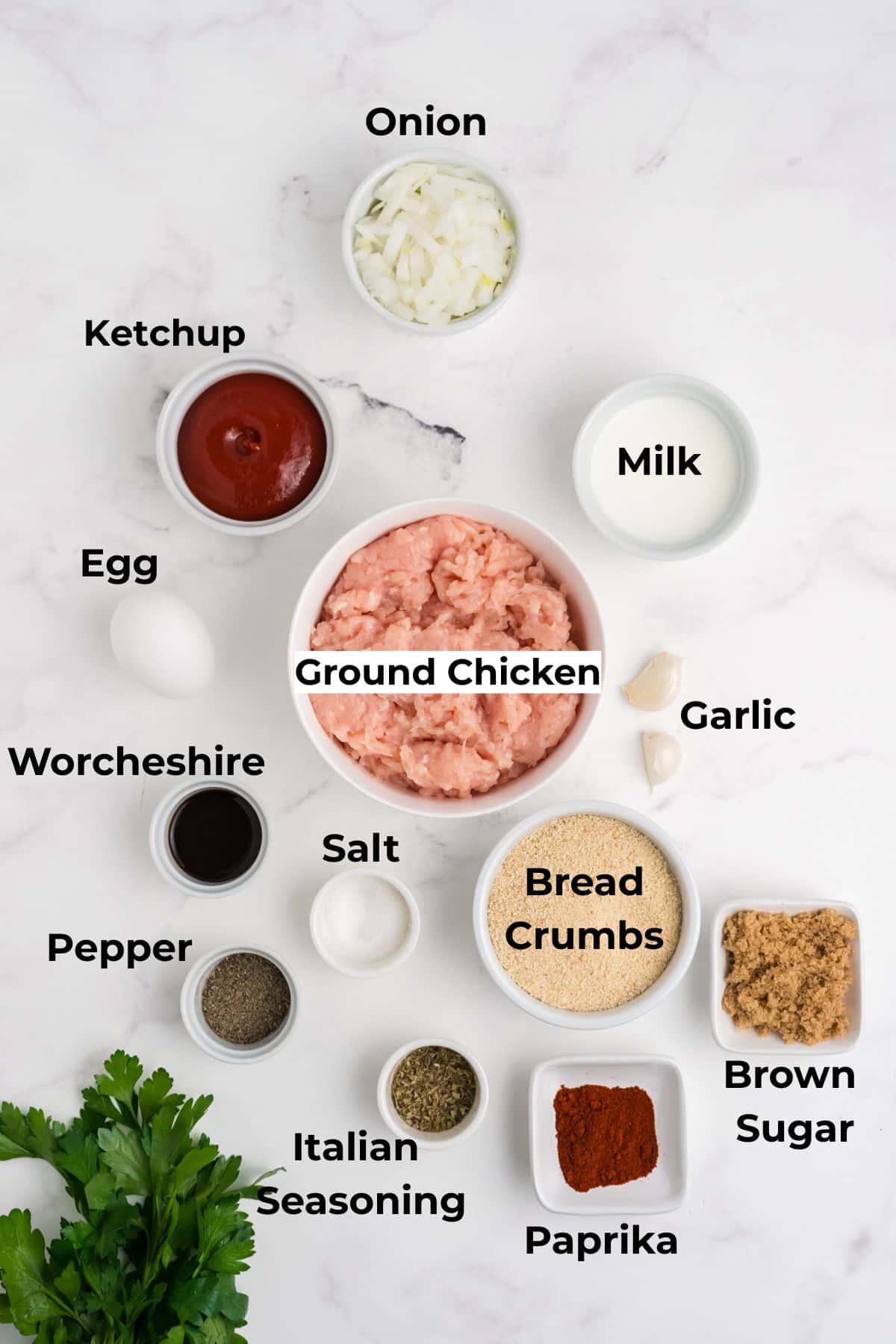 Ingredients to make this chicken meatloaf recipe in bowls on a table.