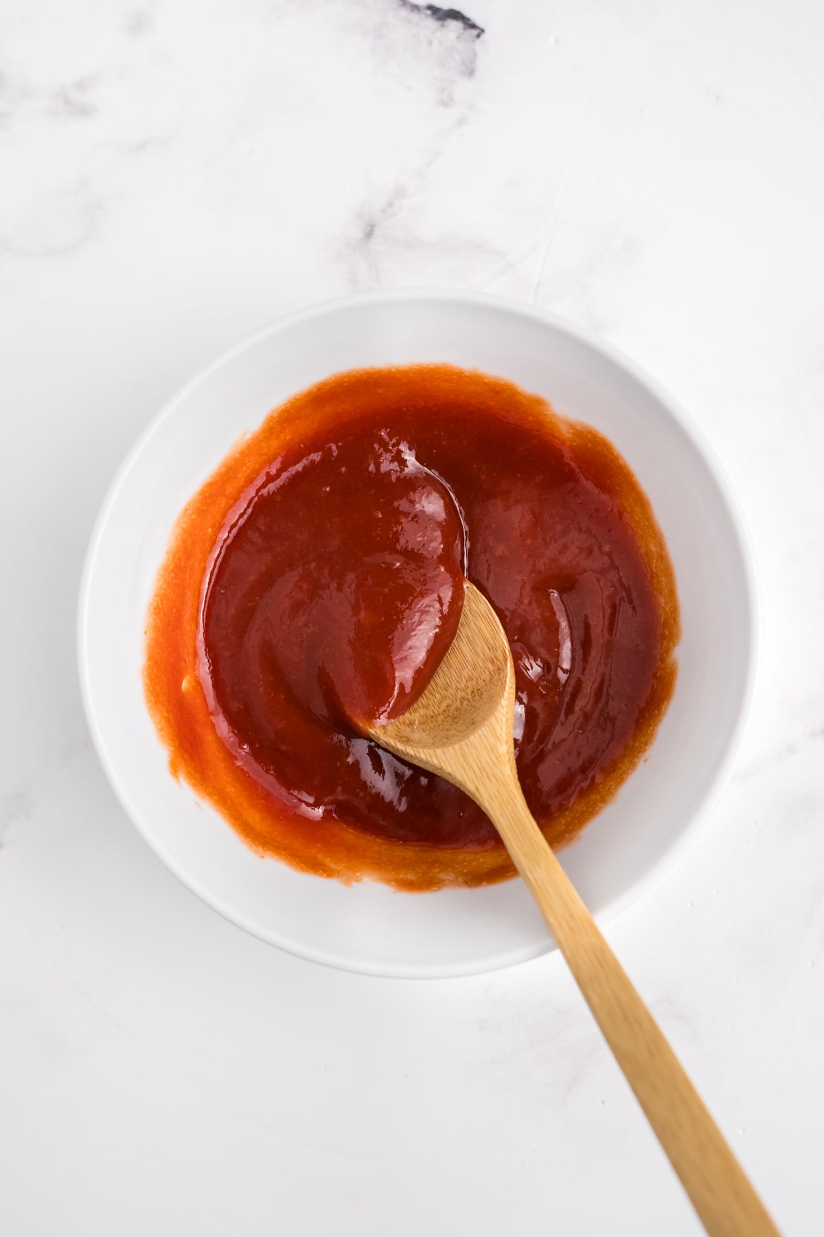 Ketchup and brown sugar mixed in a bowl.