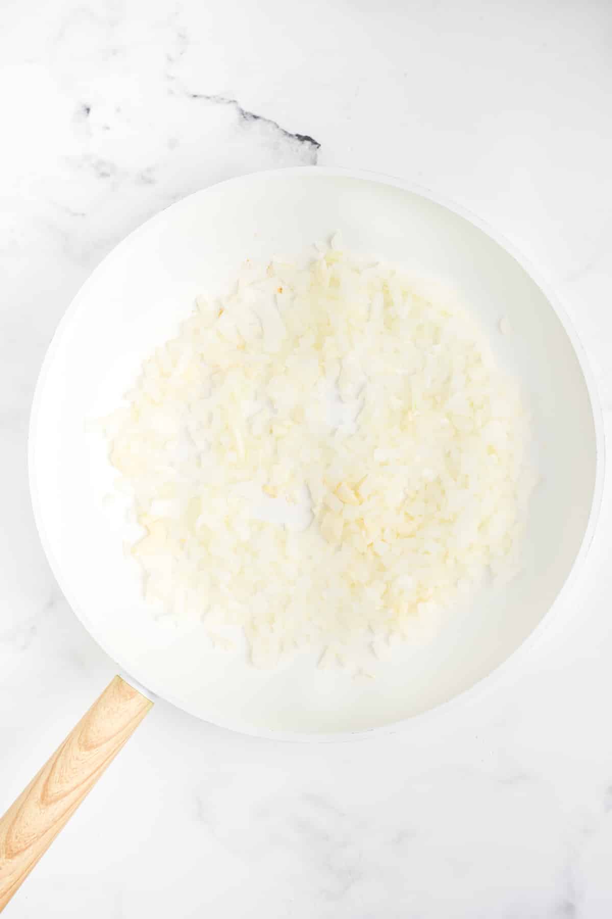 Onion and garlic in a pan.