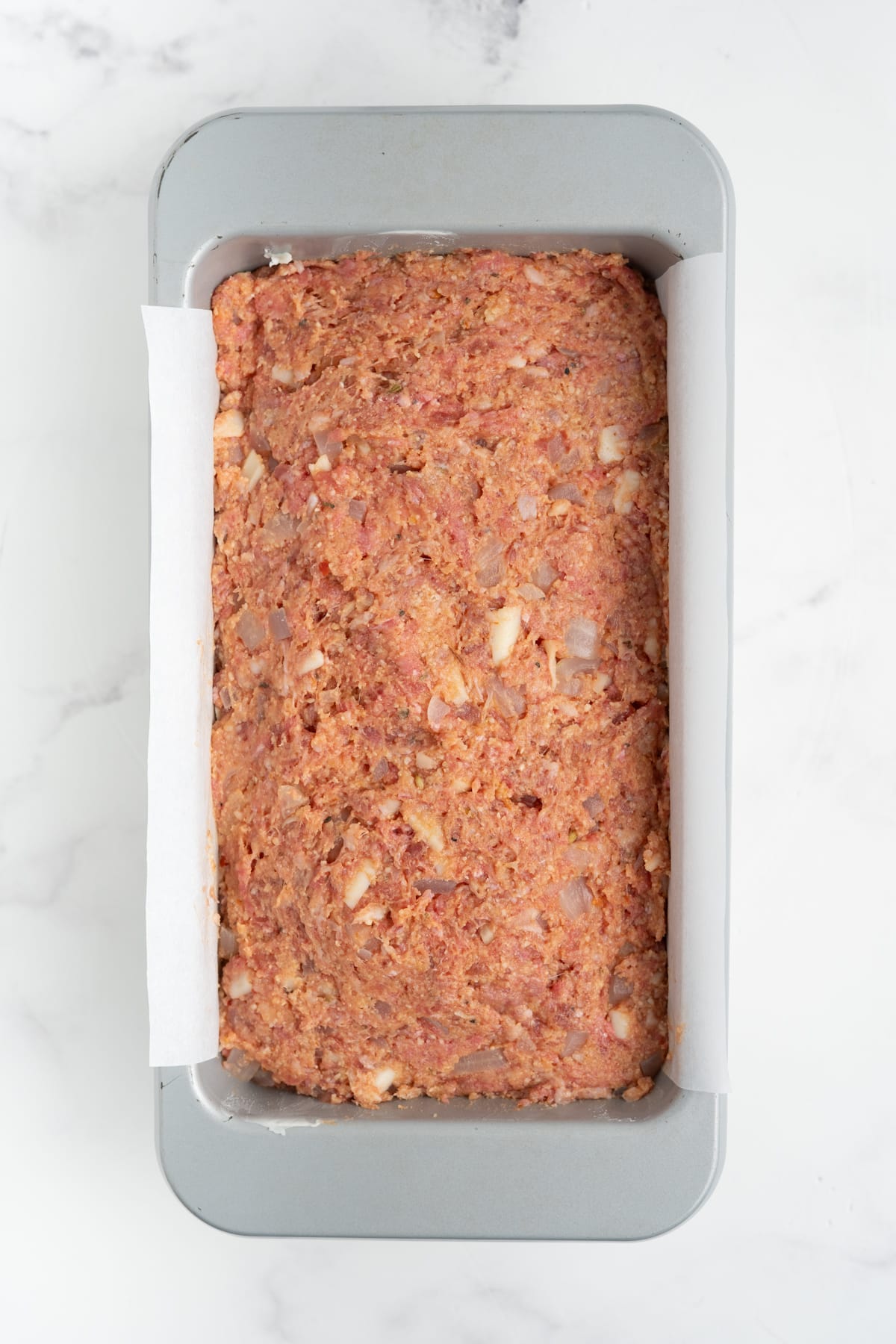 The mixture added to the prepared loaf pan.