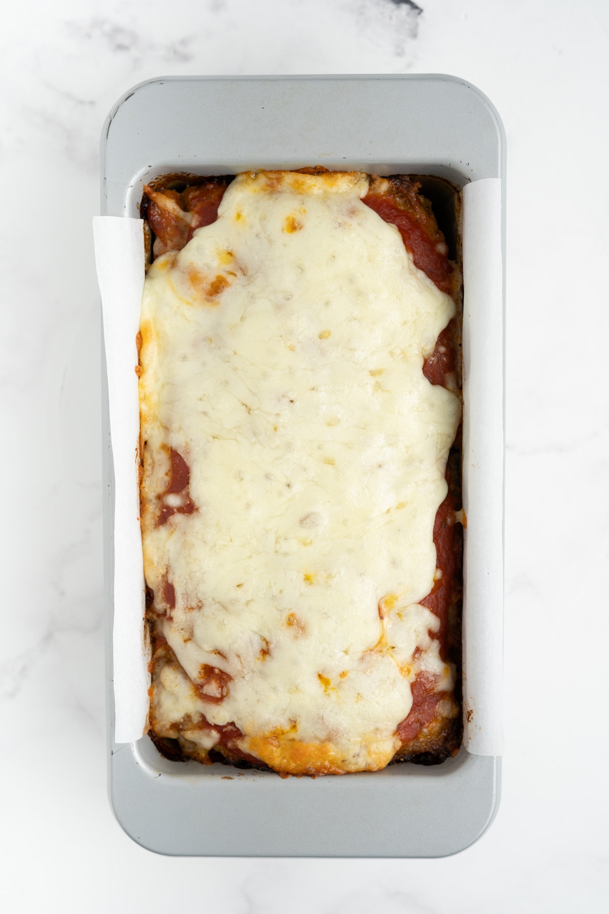 Melted cheese on the meatloaf.