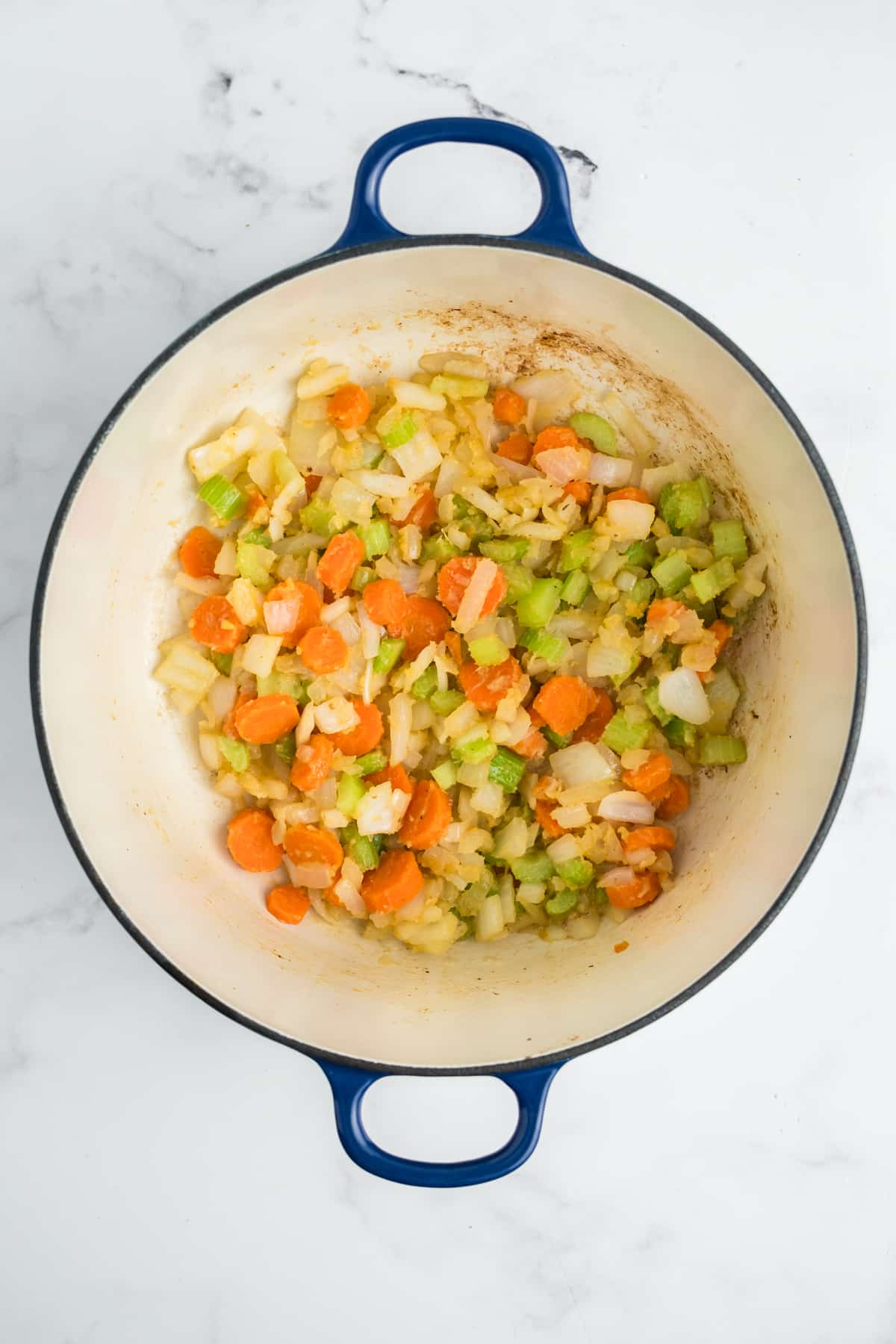 Butter and flour into the onion, carrot, and celery mixture.