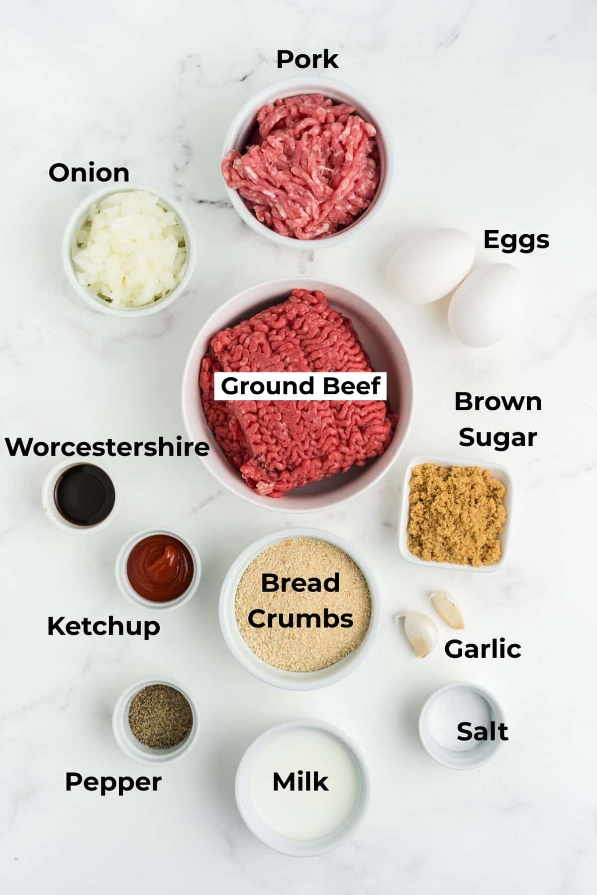 Ingredients to make these meatloaf meatballs in bowls on a table.
