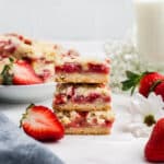 Three fresh strawberry bars stacked on top of another.