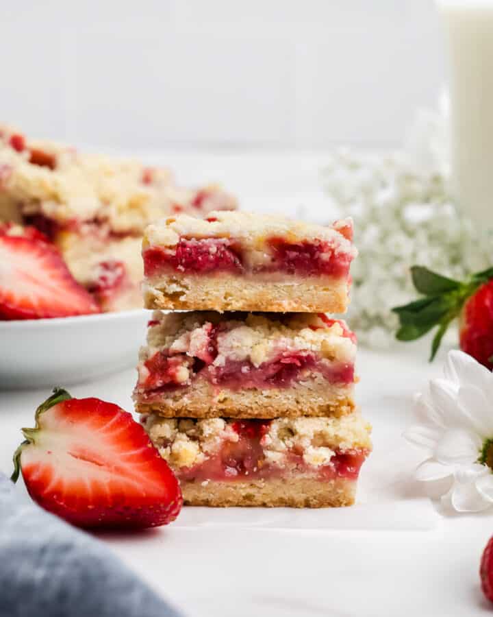 Three fresh strawberry bars stacked on top of another.