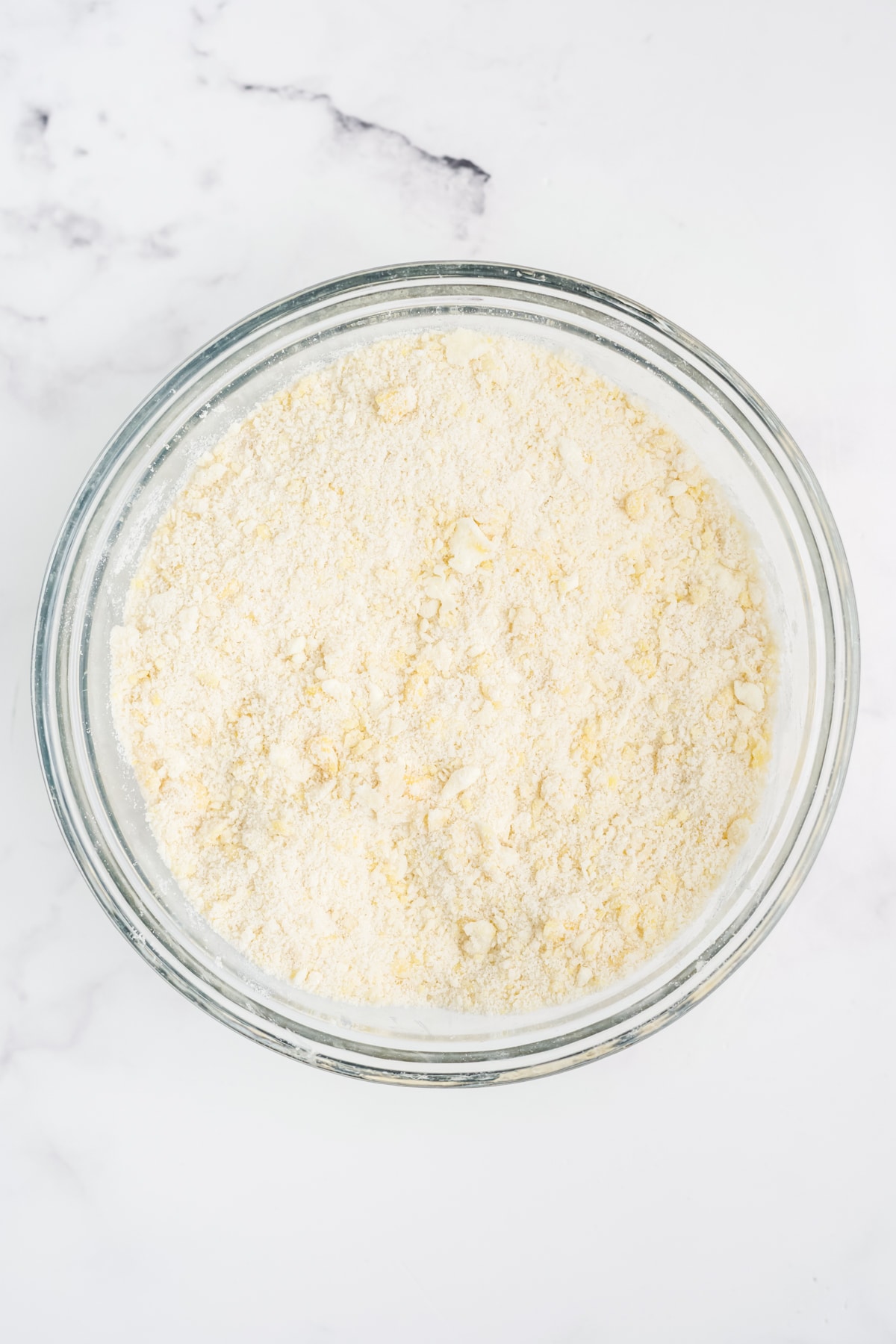 Cubed butter added to the flour mixture.