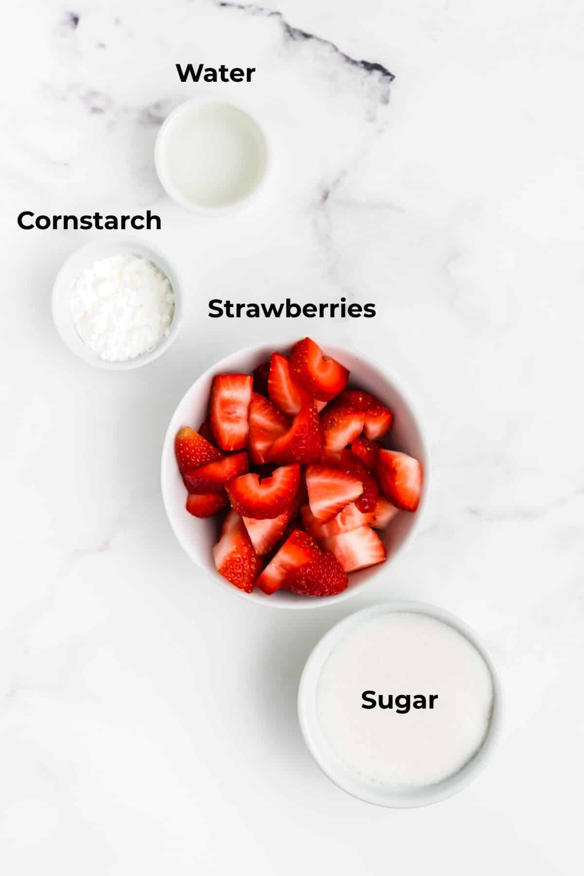 Ingredients to make these cookies in bowls on a table.
