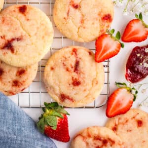 Strawberry sugar cookies on a cooling rack.