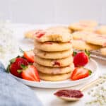 A stack of strawberry sugar cookies on a plate.