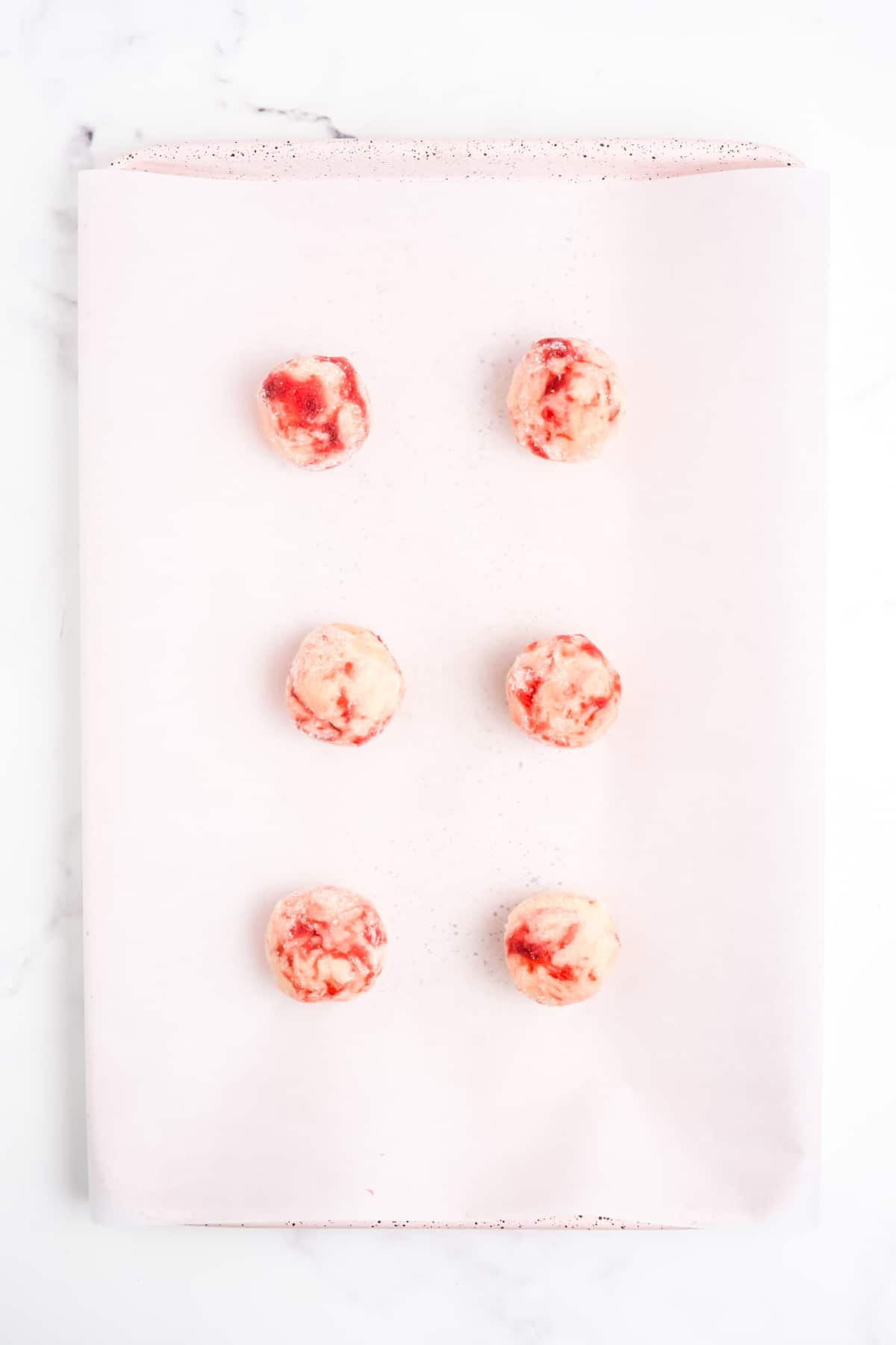 Thr dough balls onto the prepared baking sheet.