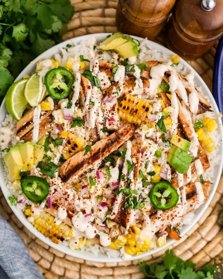 Overhead image of a bowl of street corn chicken and rice bowl